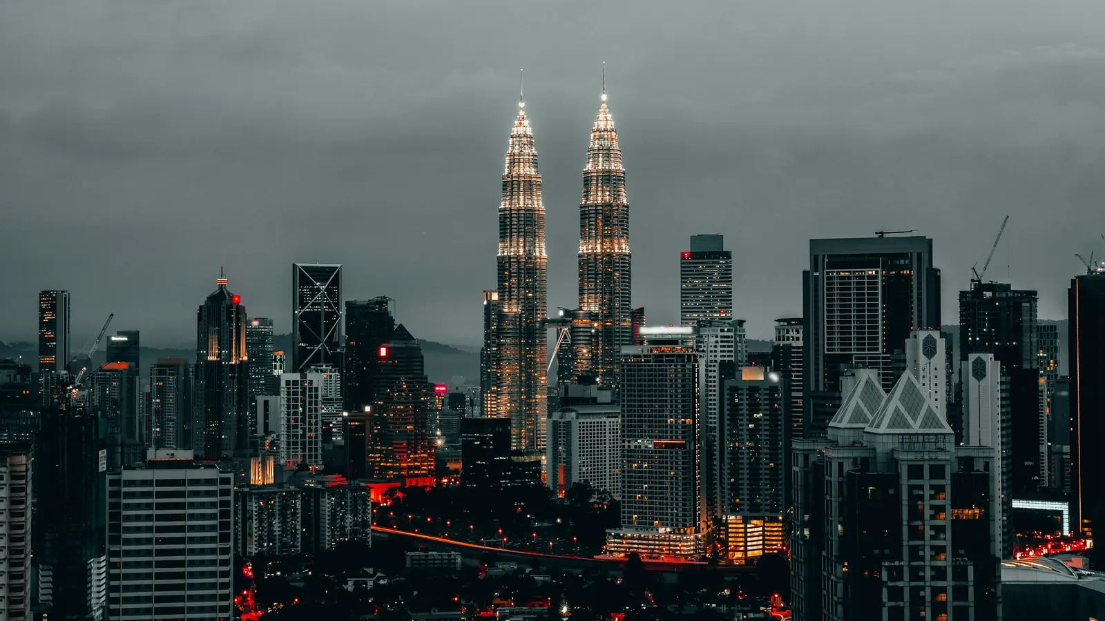 Kuala Lumpur skyline at dusk with the Petronas Twin Towers